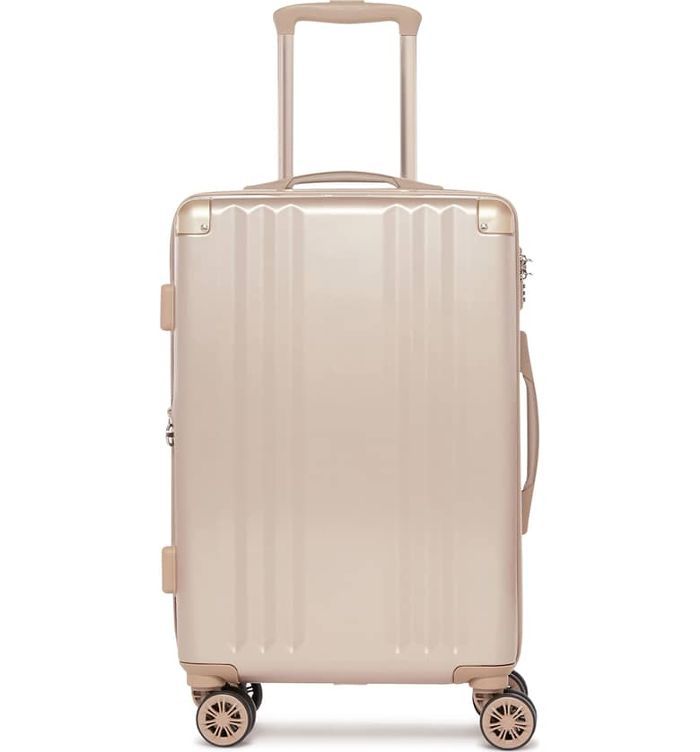 有轮子和加长提手的粉红色手提箱。