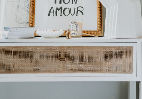 Nightstand with French decor accents.