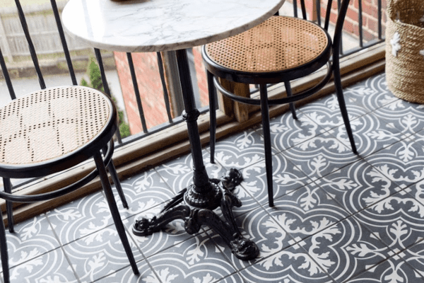 Outdoor balcony with table.