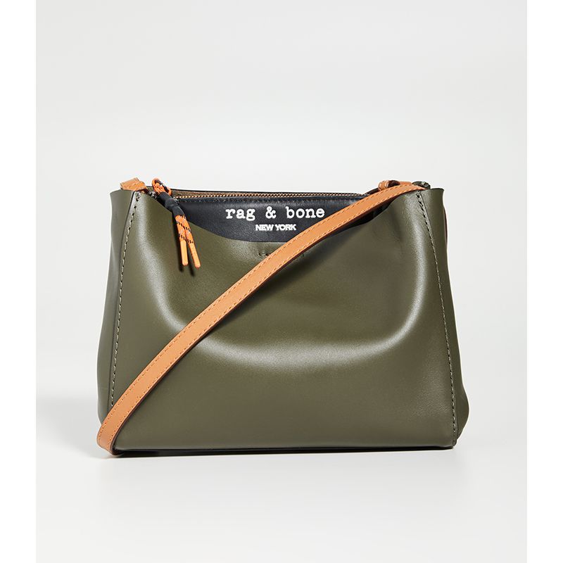 绿色皮革斜背包般地彩色表带。