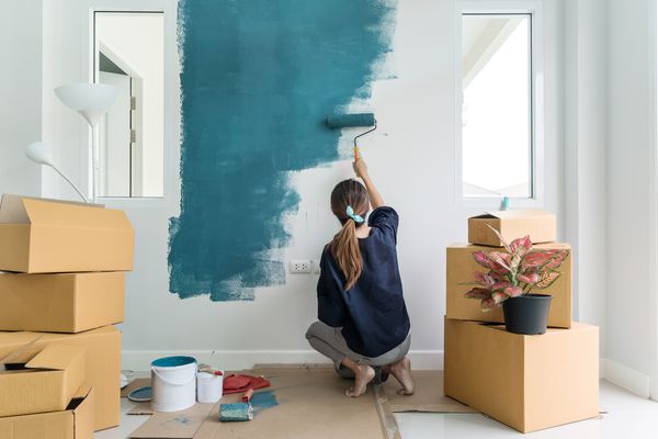 woman painting wall