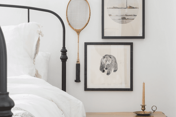 Bedroom with vintage art.