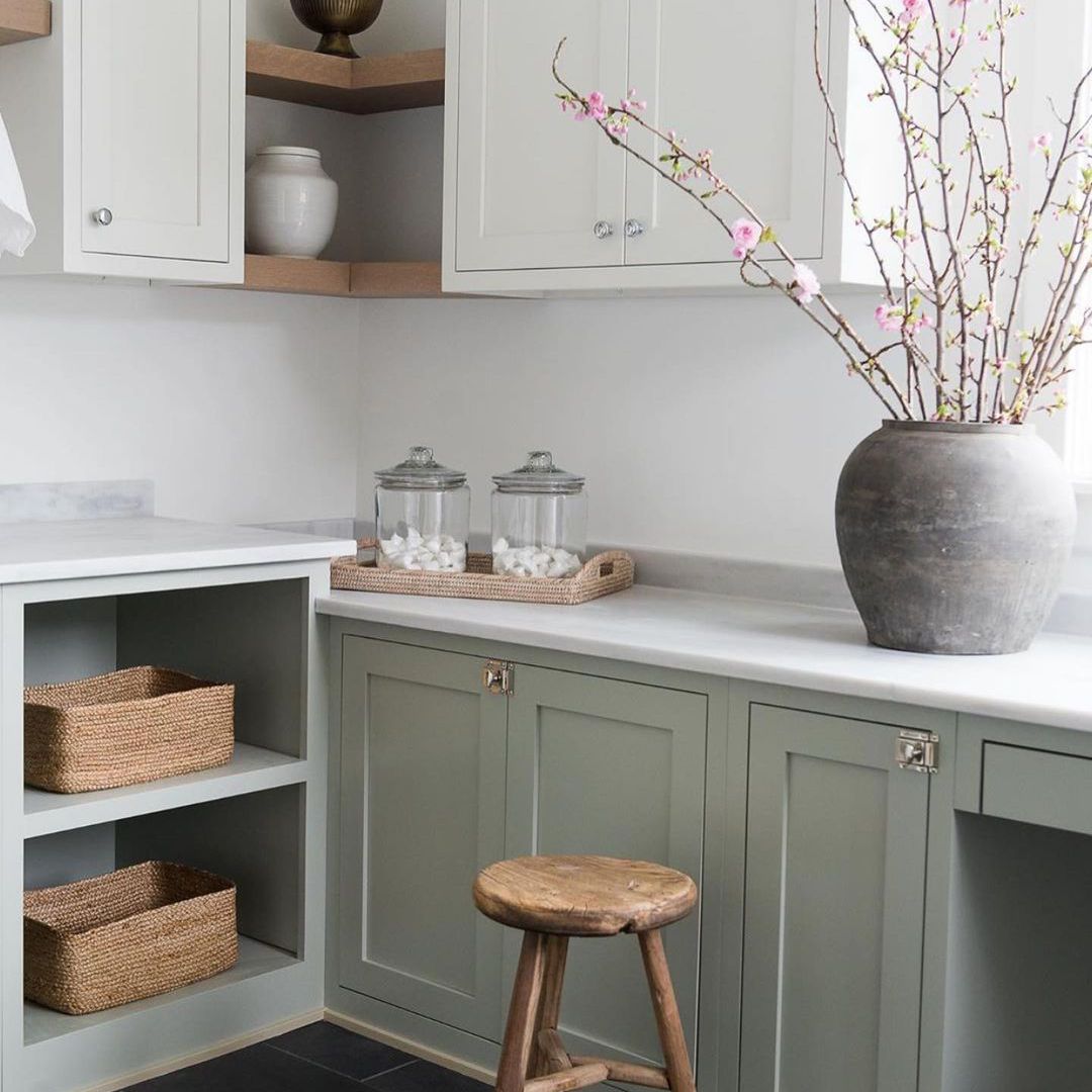 Green laundry room with shelves