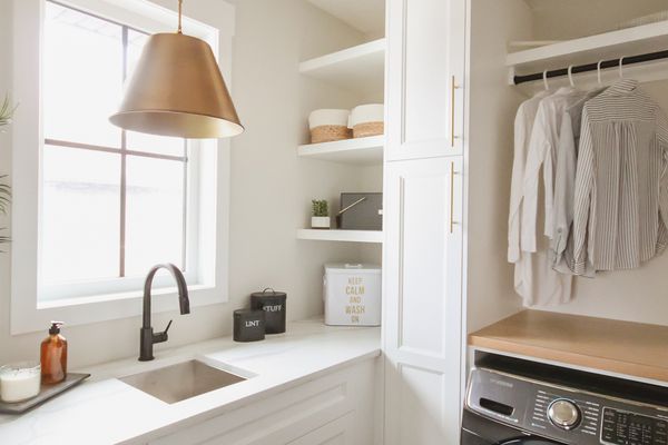 Laundry room with black floor