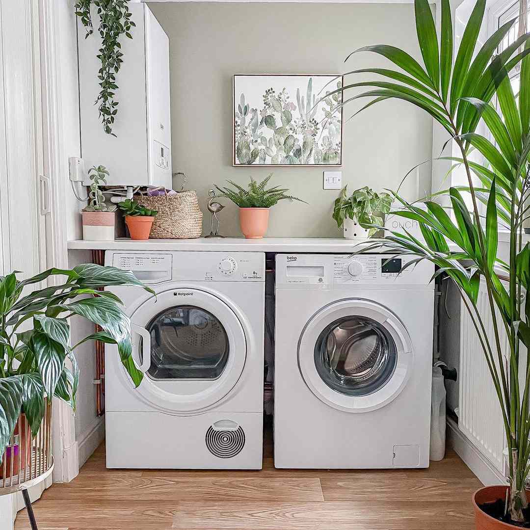 Laundry with shelf on top of washer and dryer