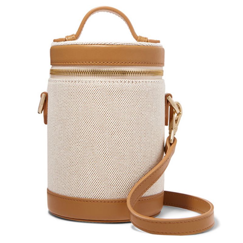 帆布和皮革镶边桶形斜挎包。