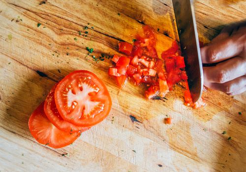 Diced tomatoes on wooden cutting board