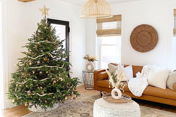 living room with leather sofa and christmas tree