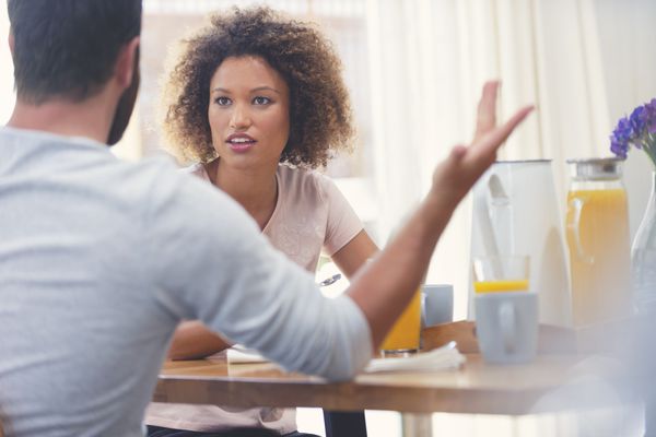 Couple arguing at the kitchen table