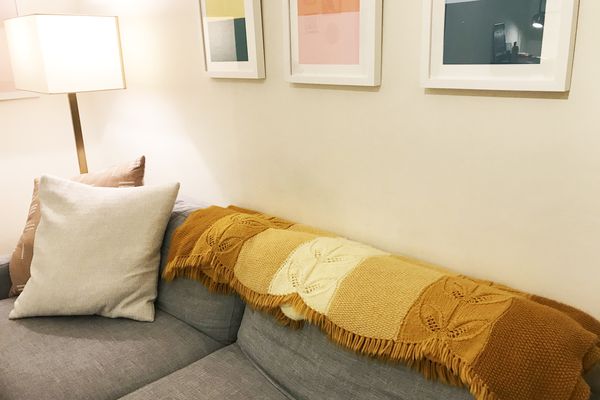 how to mix old and new decor - handknit blanket on sofa