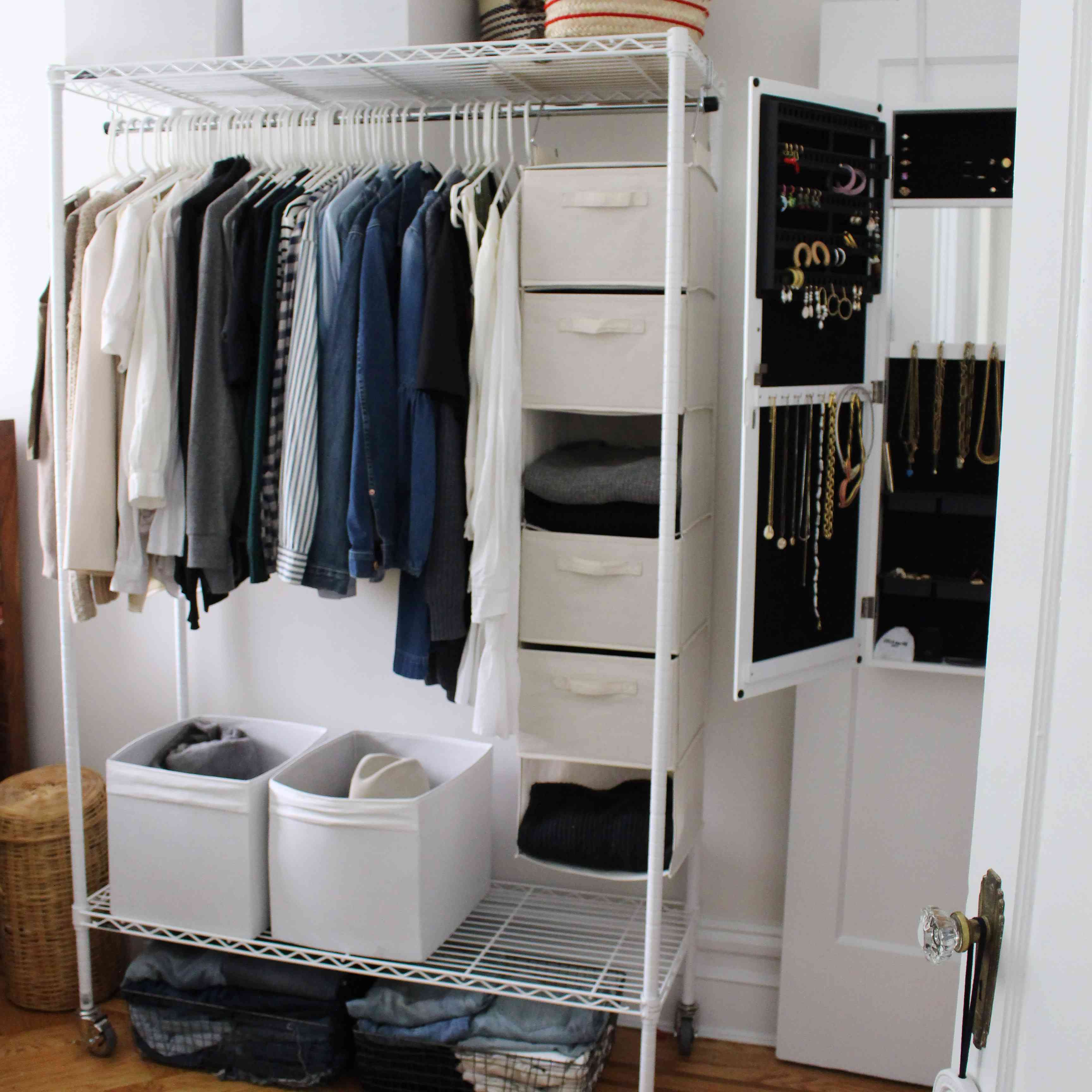 clothing rack outside of a closet