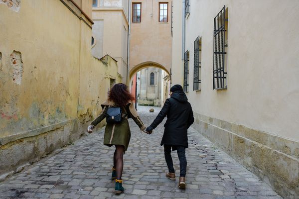 Couple Walking Down Corridor
