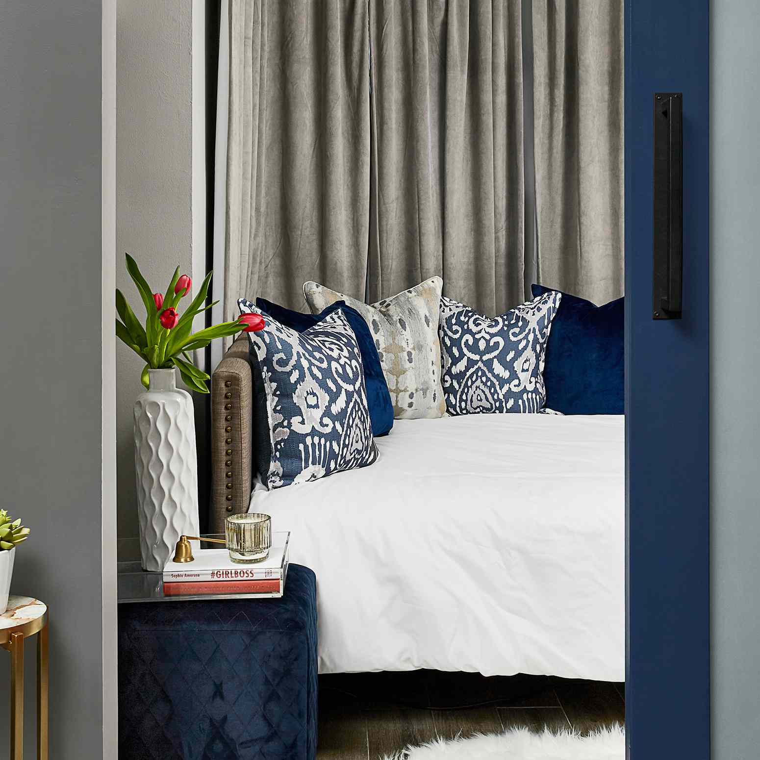 Duke Ellington home tour - cozy guest room with navy accents