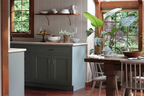 A kitchen with light blue cabinets