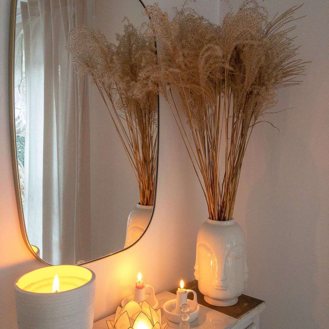 Lit candles on nightstand.