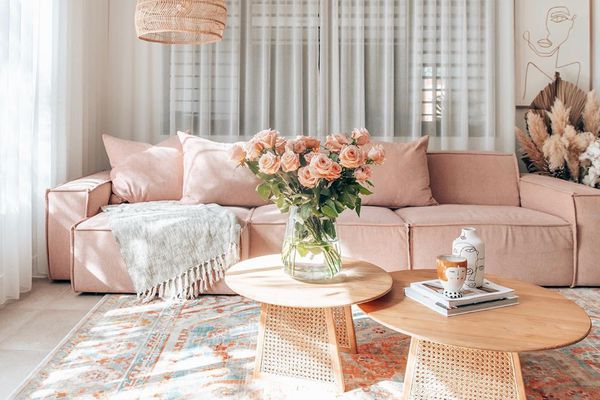 Pink couch and two coffee tables.