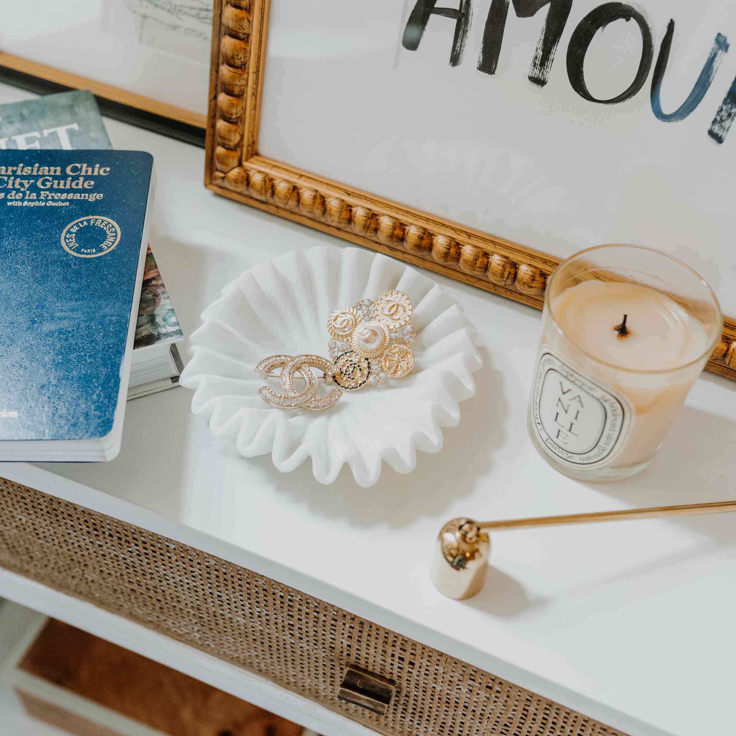 Close-up of jewelry and candle.