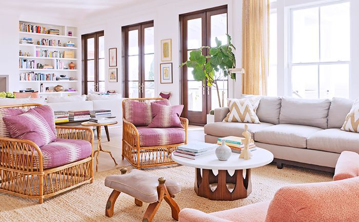 Rucker home的一个座位区配有柔和和中性色调的沙发和椅子