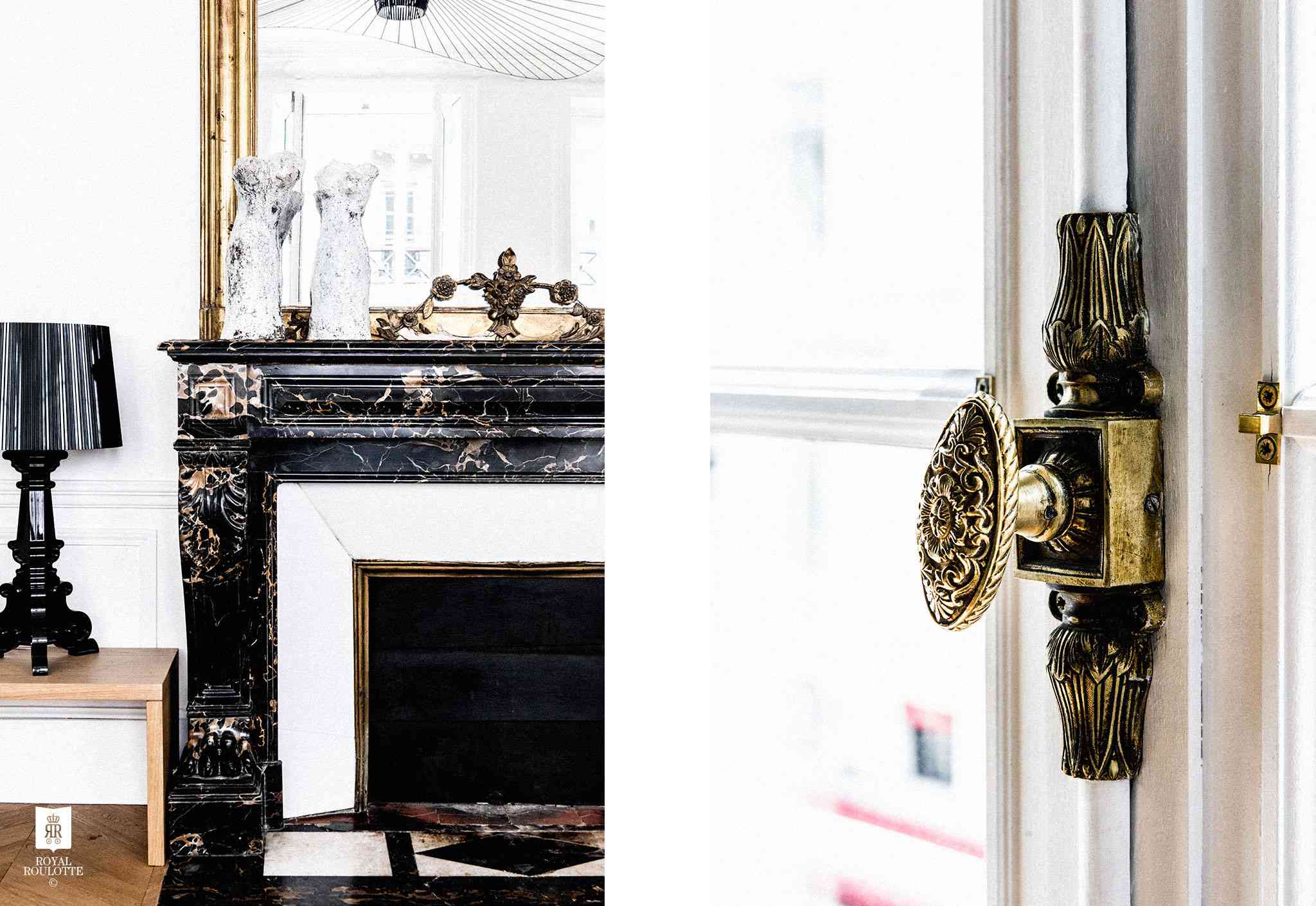 带黑色大理石壁炉和华丽的金色口音的起居室